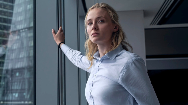 Zara Dunne standing by a window in Steal