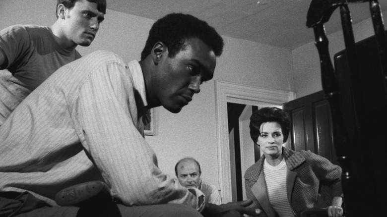 Ben and others in living room watching TV