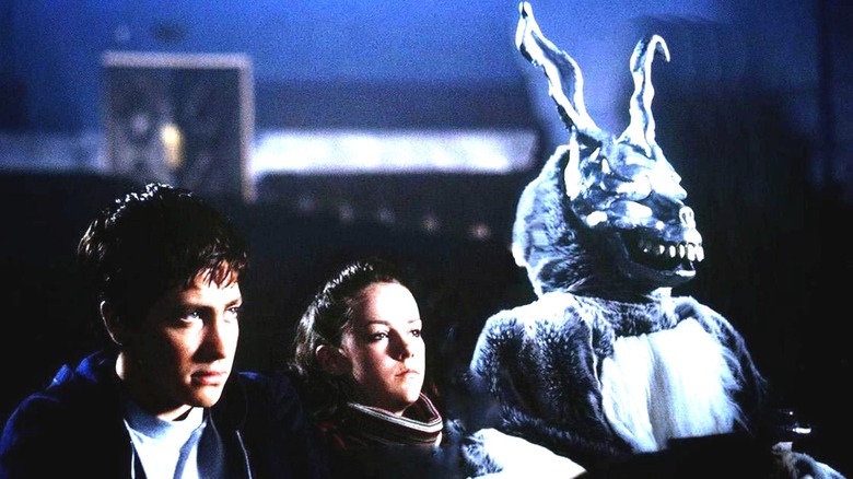 Donnie, Gretchen, and Frank the Rabbit in a movie theater in "Donnie Darko"