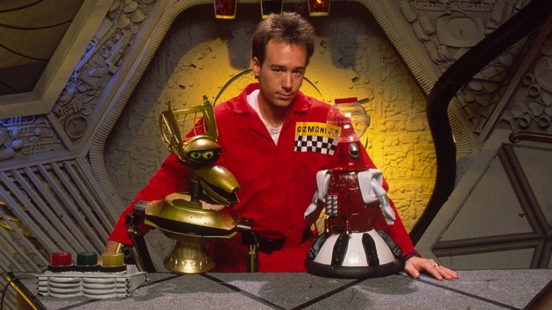 Joel with his robots Crow T. Robot and Tom Servo in "Mystery Science Theater 3000"