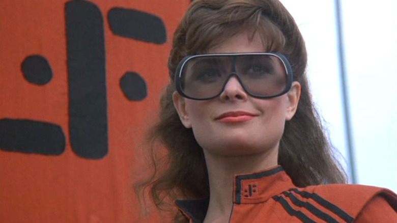 Diana wearing goggles and smiling in "V"