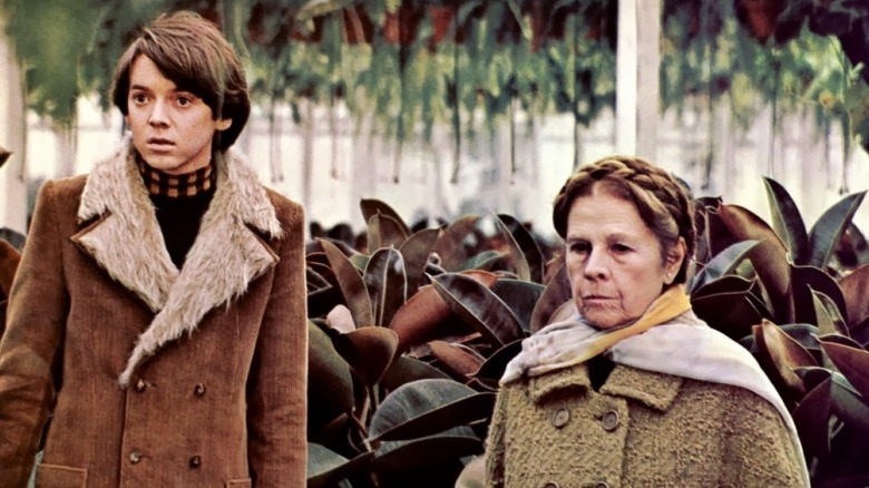 Harold and Maude surrounded by plants