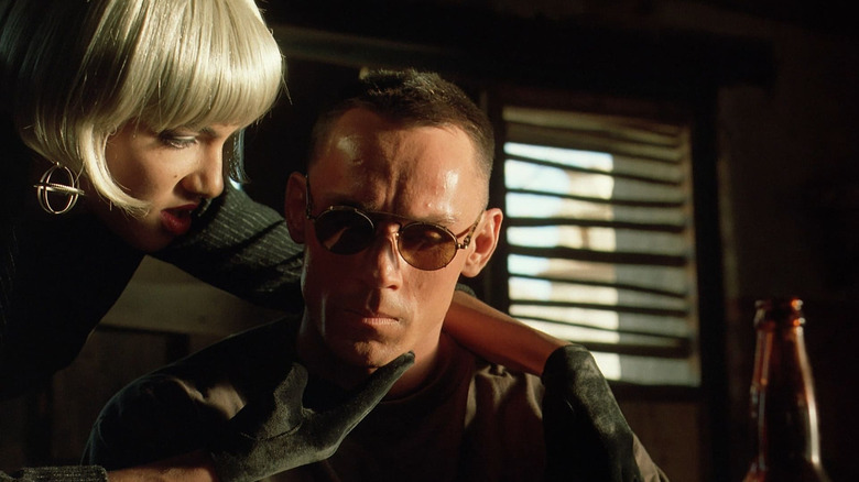 Jared caresses Alex Rain in "Nemesis" (1992)