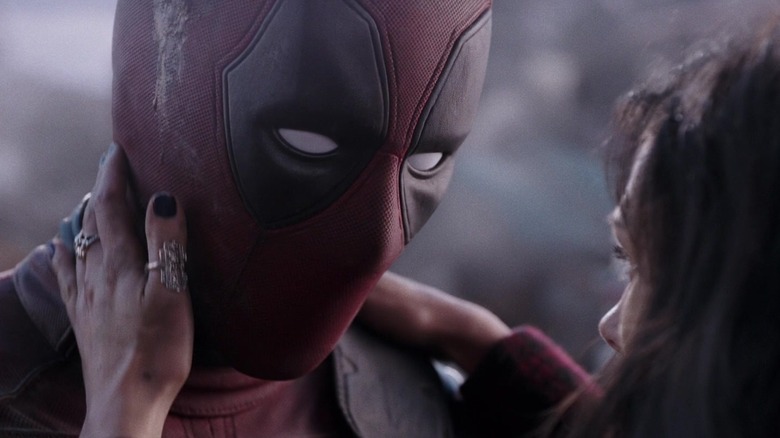 Vanessa touches Deadpool's neck in "Deadpool" (2016)