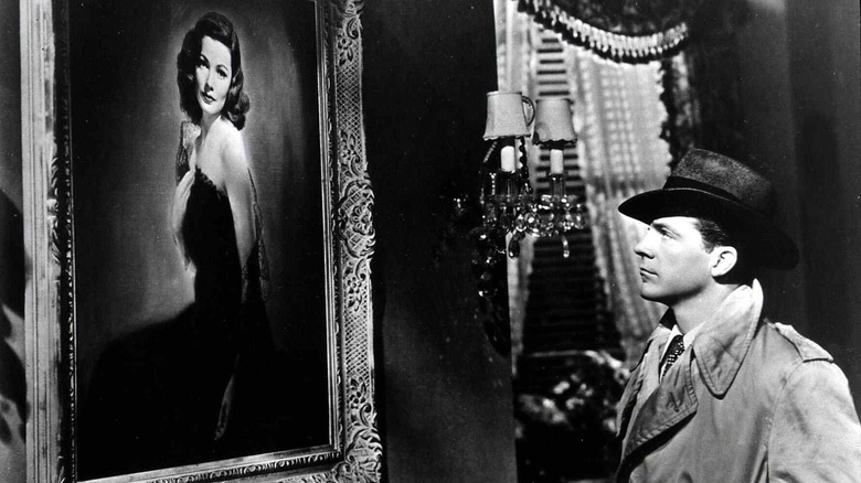 Mark McPherson looks at a painting of the title character in Laura (1944)