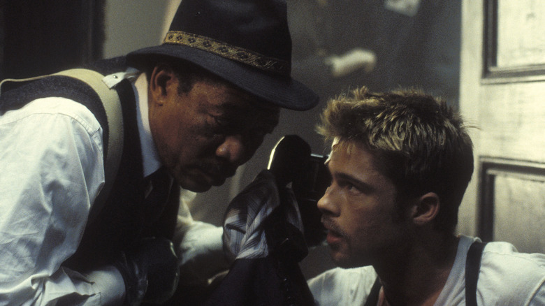 Detectives Somerset and Mills take a phone call in "Seven" (1995)
