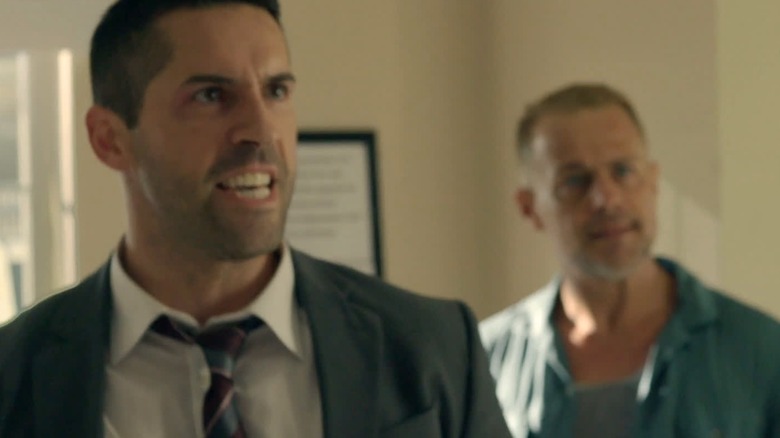French and Louis standing together in "The Debt Collector"
