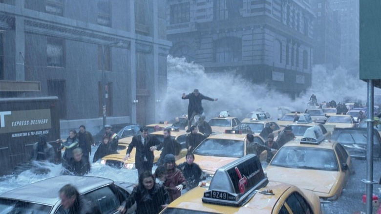 A group of New Yorkers run from a giant wave in 'The Day After Tomorrow' (2004)