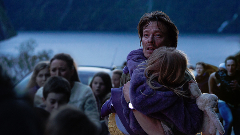 Kristian runs with his daughter amid a crowd in 'The Wave' (2015)