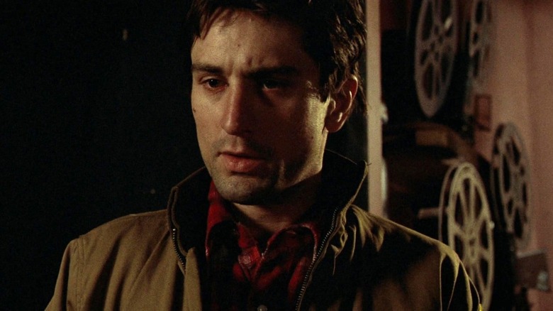 Robert De Niro's Travis Bickle looking ahead in Taxi Driver