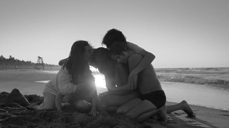 Family on beach in Roma