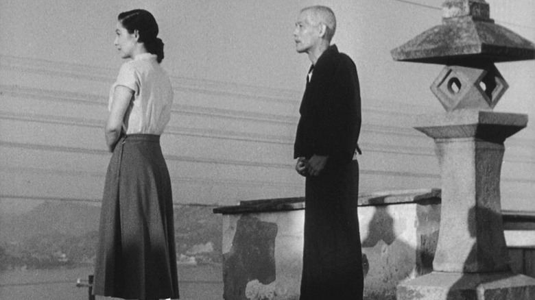 Shukichi and Noriko stand outside