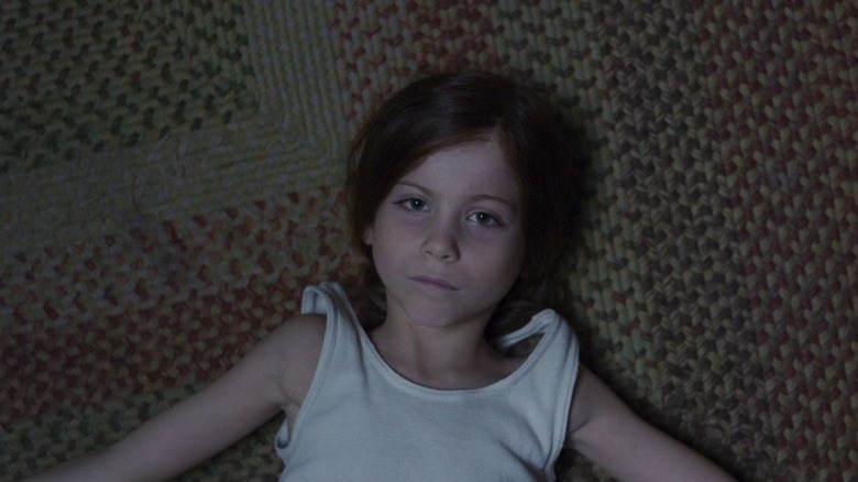 Jacob Tremblay lying on rug