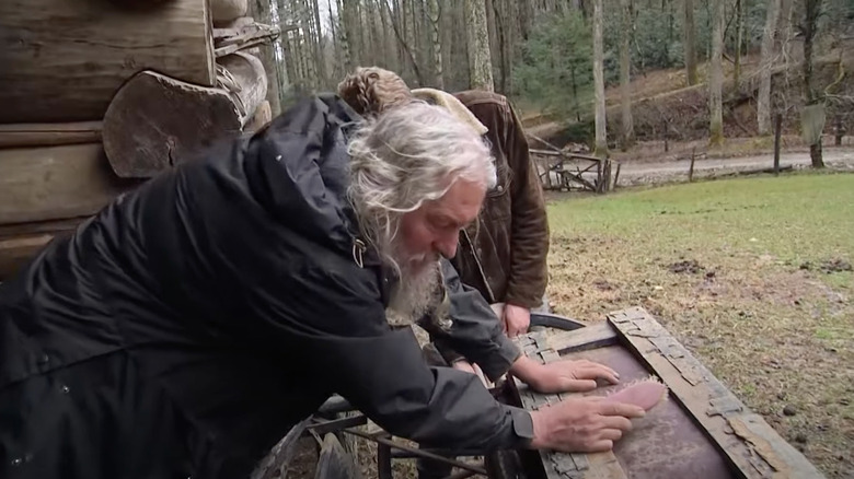 Eustace works on wood