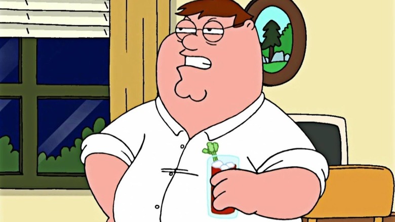 Drunk Peter holding a drink