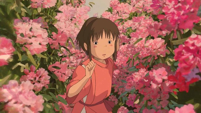 Chihiro running through the flowers in Spirited Away (2001)