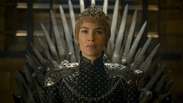 Cersei Lannister on the Iron Throne frowning