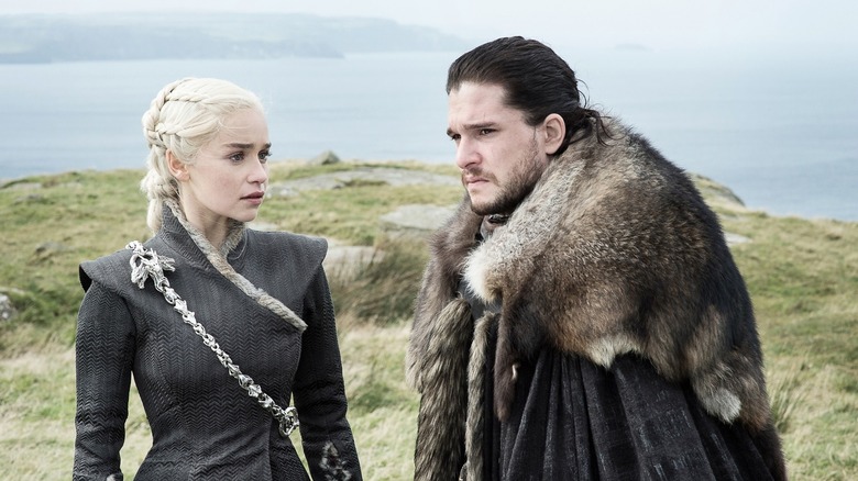 Daenerys Targaryen and Jon Snow standing on cliffside in Game of Thrones