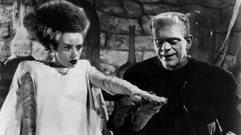 The Monster takes the Bride's hand in Bride of Frankenstein (1935)
