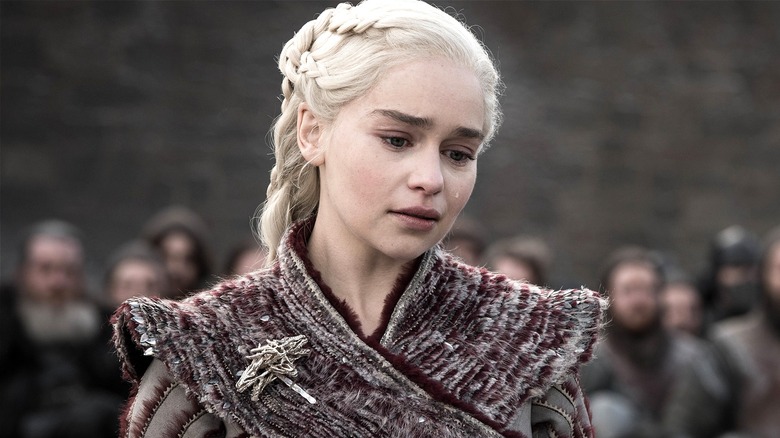 Daenerys tilting head with a tear on her cheek