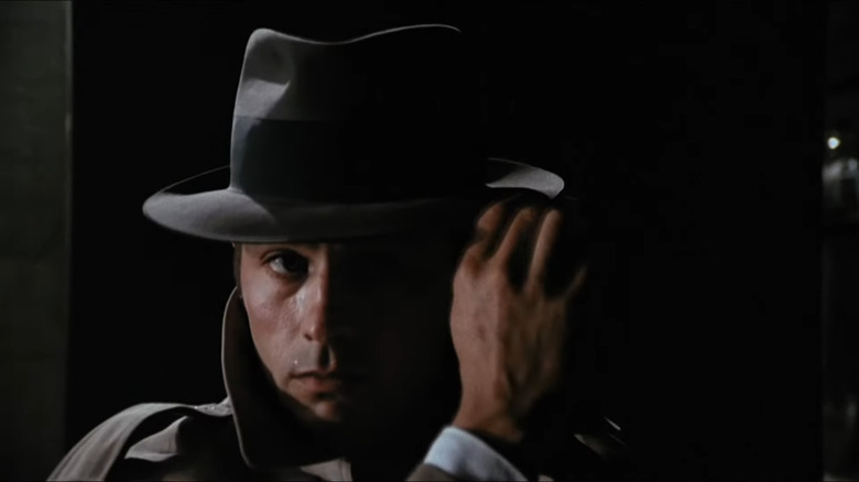 Alain Delon wears hat