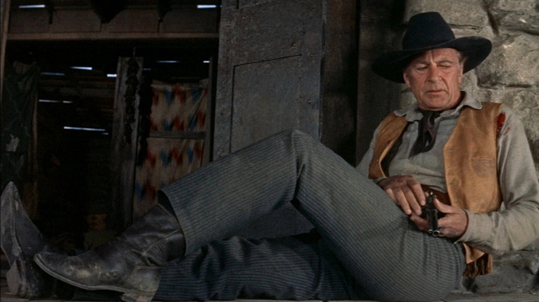 Gary Cooper holds gun