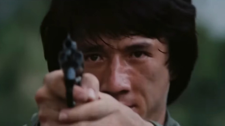 Jackie Chan with gun