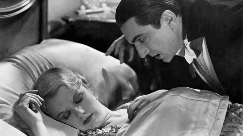 Dracula hovers over Lucy in "Dracula" (1931)