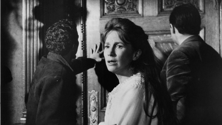 Eleanor hears a ghost in "The Haunting" (1963)