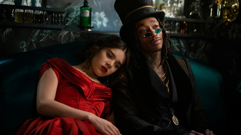 Emily leaning against Death in Dickinson