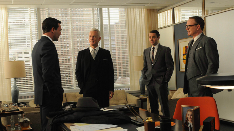 Don Roger Pete and Lane talking in the office on Mad Men