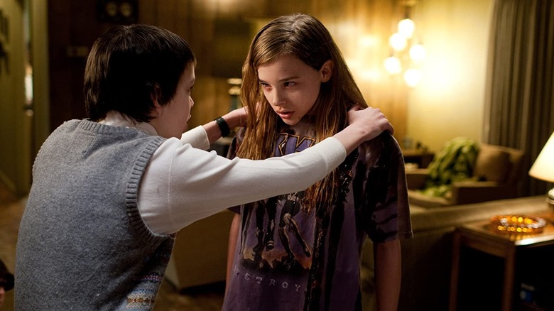 Owen holds Abby's shoulders in 'Let Me In' (2010)