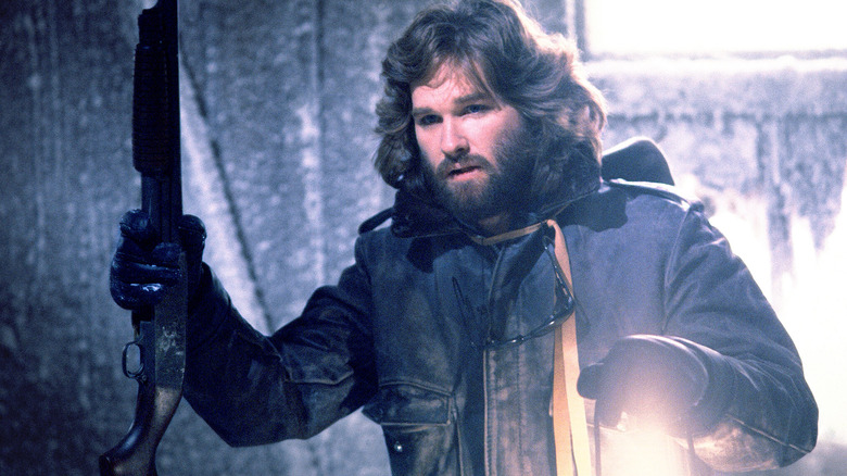 MacReady holds a shotgun in 'The Thing' (1982)