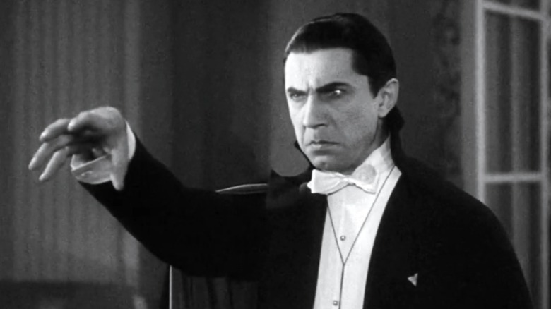 Count Dracula reaches for Van Helsing in "Dracula" (1931)