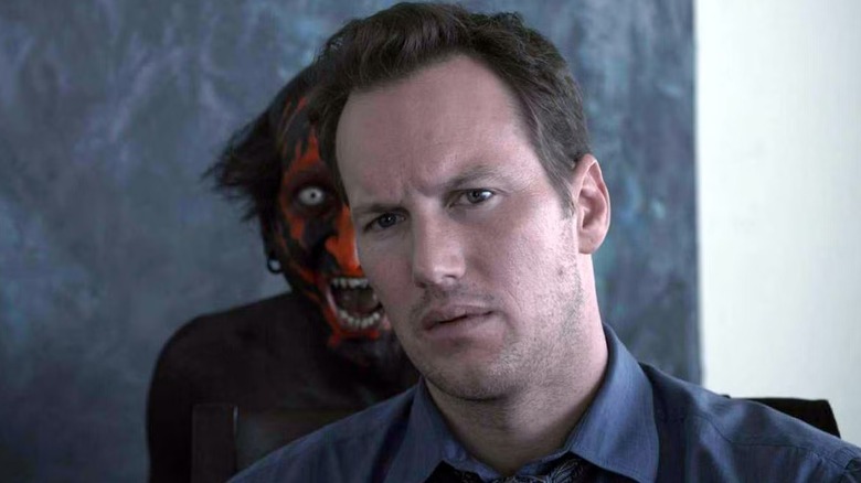 A demon lurks behind Josh in "Insidious" (2011)