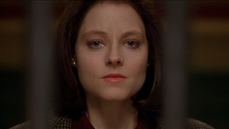 Clarice Starling looking serious through prison bars