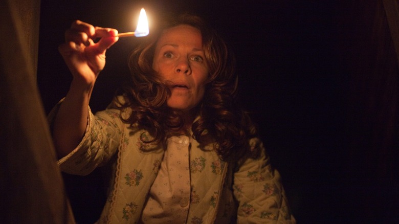 Conjuring lady with match