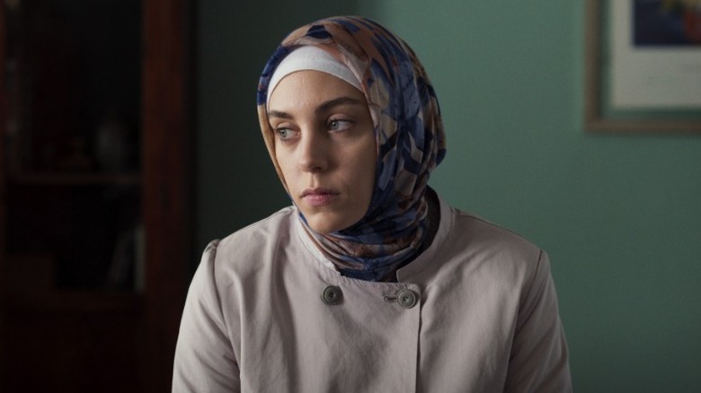 Meryem looking severely to her right on Ethos