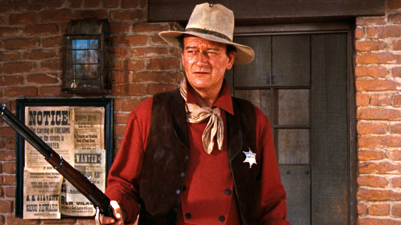 John T. Chance standing on the sheriff's porch in "Rio Bravo" (1959)