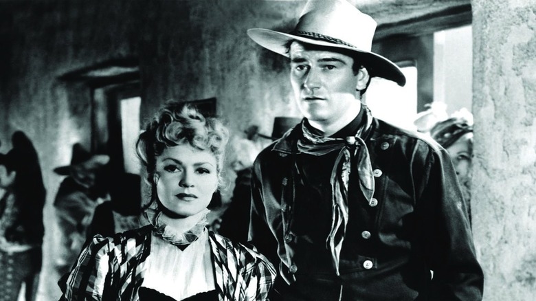 Dallas and the Ringo Kid stand together in "Stagecoach" (1939)