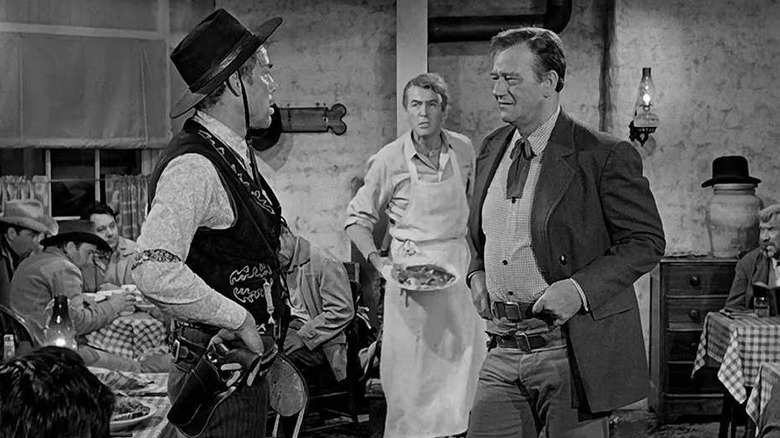 Liberty Valance confronts Tom Doniphon while Ranse Stoddard looks on in "The Man Who Shot Liberty Valance" (1962)