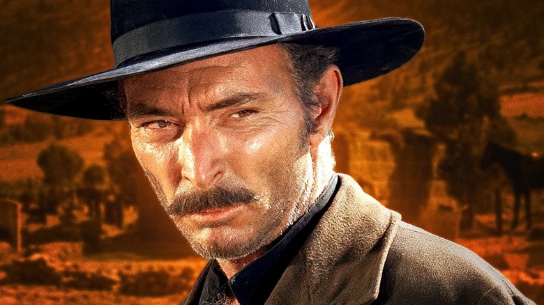 Angel Eyes looking focused and wearing a black hat in 