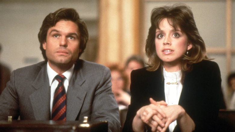 Michael Kuzak and Abby Perkins frowning in the courtroom in "L.A. Law."