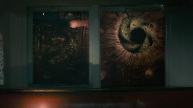 Grabber looking through window in Grabbers