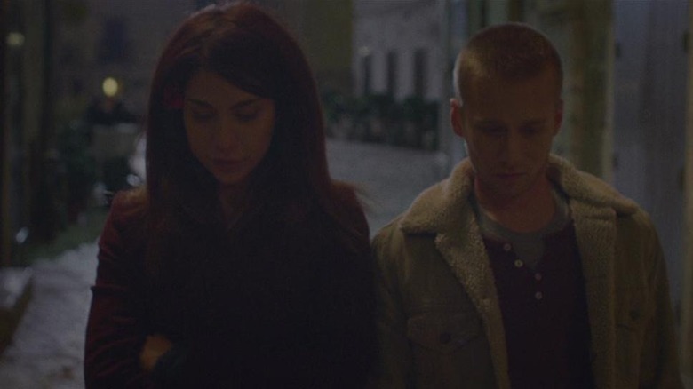 Evan and Louise walking down an alleyway in Spring