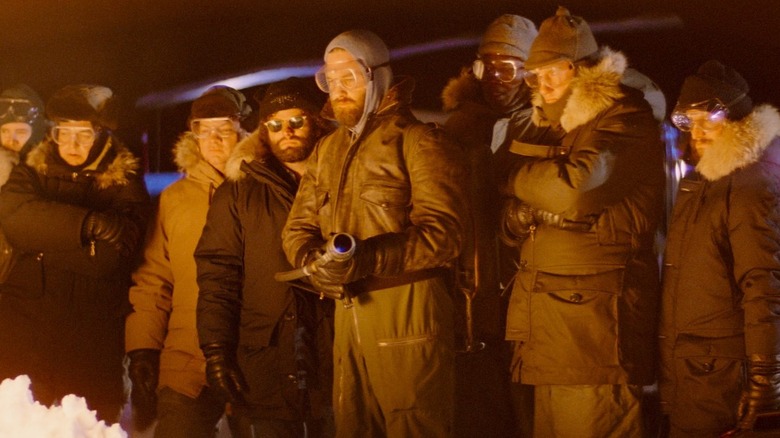 Thing cast huddled together