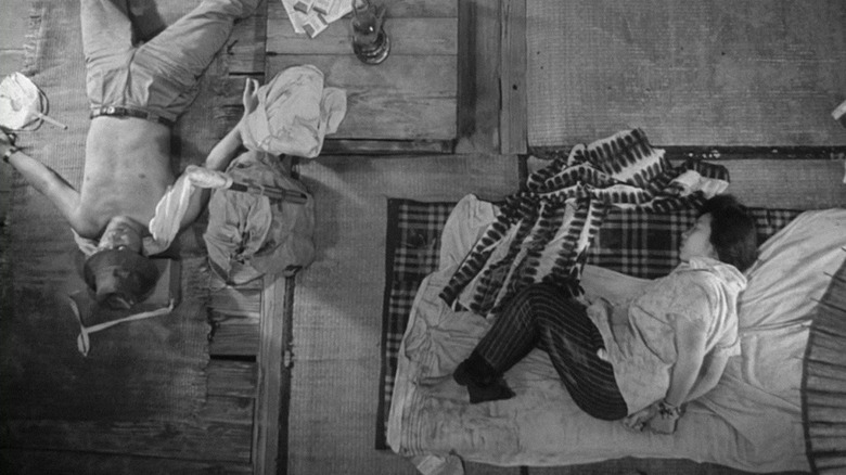 The two leads of Woman in the Dunes resting during their torment