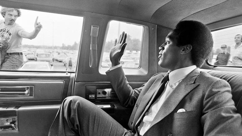 O.J. Simpson waving to fans in an archival photo from O.J.: Made in America (2016)