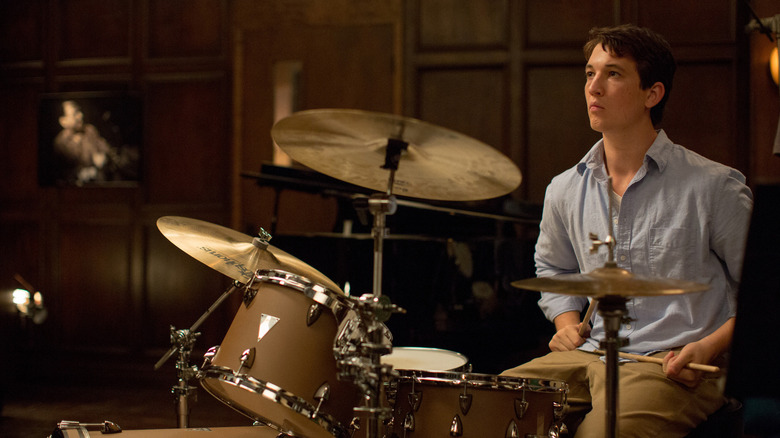 Andrew Neiman sitting behind a drum set in Whiplash (2014)