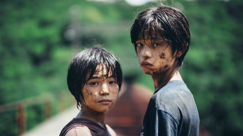The two adolescent leads of Monster turning around in Monster (2023)